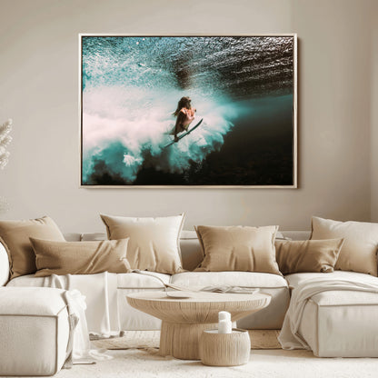 Vibrant underwater photo of a female surfer diving through turquoise waves, perfect for coastal boho or surf-inspired home decor.