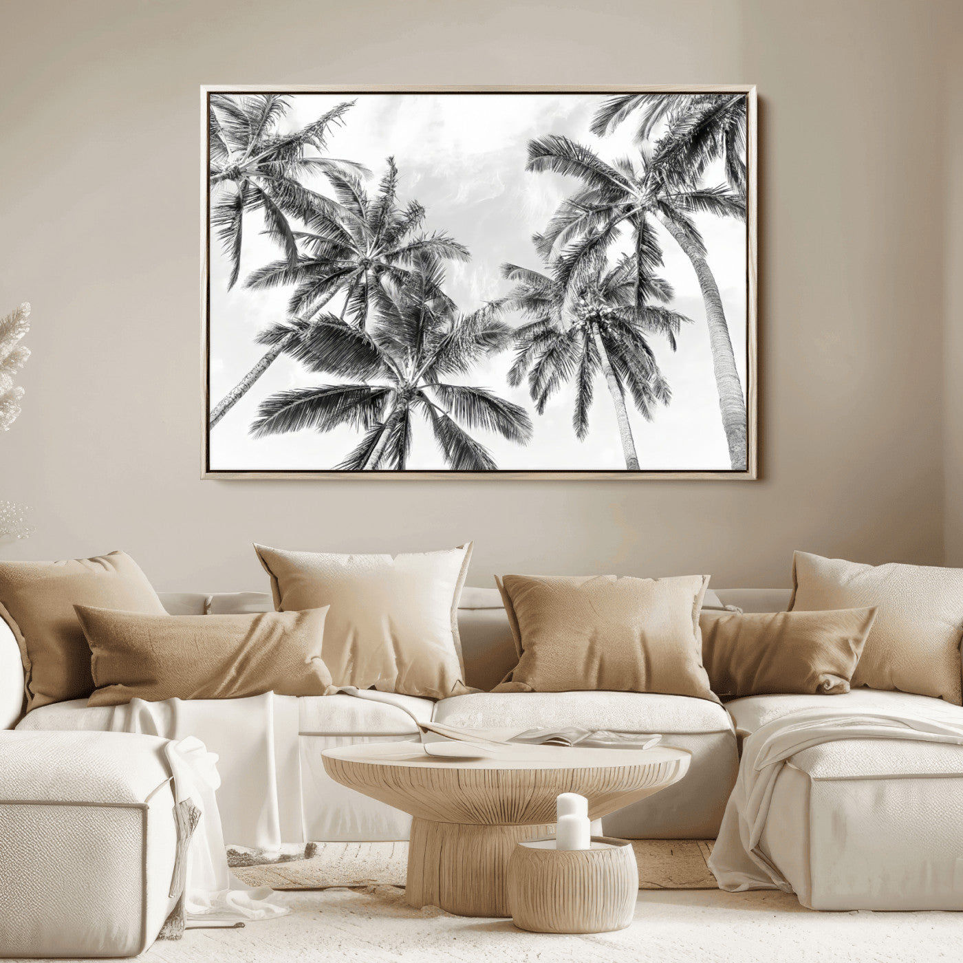 Black and white tropical palm trees viewed from below, swaying gently against a bright sky, creating a serene and elegant coastal atmosphere.