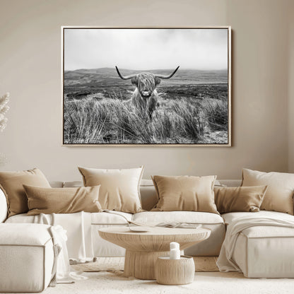 A black and white portrait of a Highland cow in a foggy Scottish countryside, capturing a rustic aesthetic and tranquil farm escape.