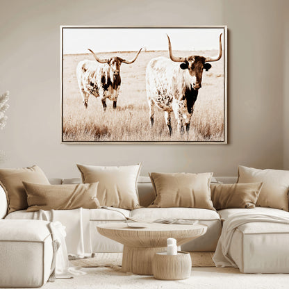 Two Texas longhorn cows standing in a sepia-toned pasture, evoking rustic charm perfect for farmhouse or western country interiors. (