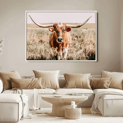 Framed longhorn cow canvas wall art with rustic prairie background, western animal print perfect for farmhouse or ranch style decor