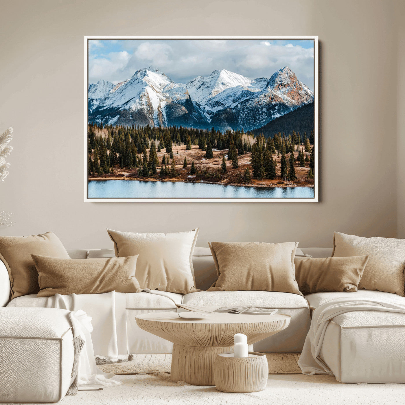 Framed canvas of snowy mountain peaks with pine forest and alpine lake, perfect for winter cabin or wilderness-inspired home decor.