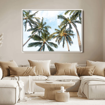 Framed canvas of tall palm trees reaching into a tropical sky, ideal for beach home or relaxed island-inspired wall decor.