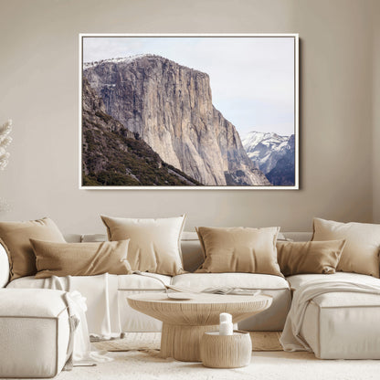 Framed canvas of El Capitan’s vertical granite face in Yosemite with snowy peaks, ideal for Sierra minimalism or mountain-inspired decor.