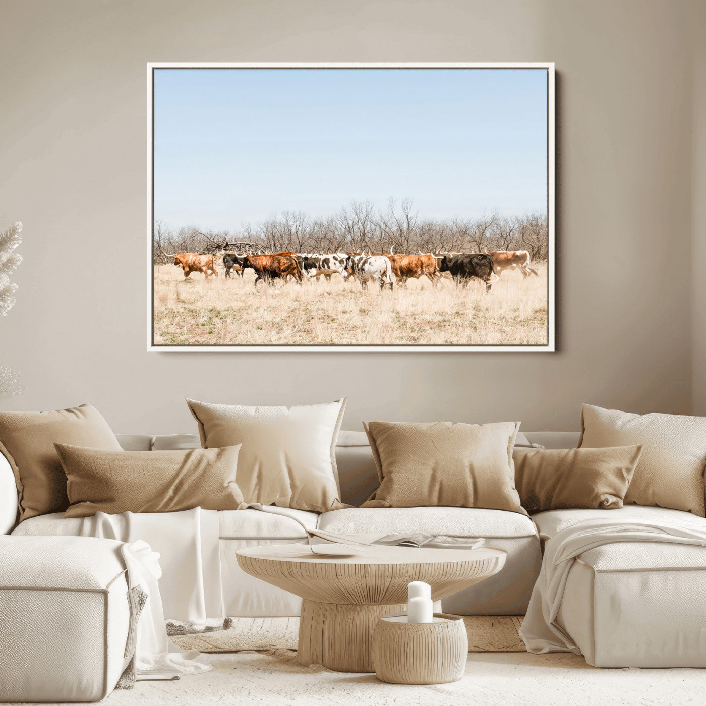 Framed wall art of Texas longhorn cattle walking through a dry, neutral-toned prairie, perfect for rustic farmhouse or western-themed home decor.