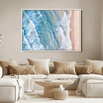 Aerial photo of soft blue waves meeting sandy shore, perfect for modern coastal or beach-themed decor with a light and tranquil aesthetic.