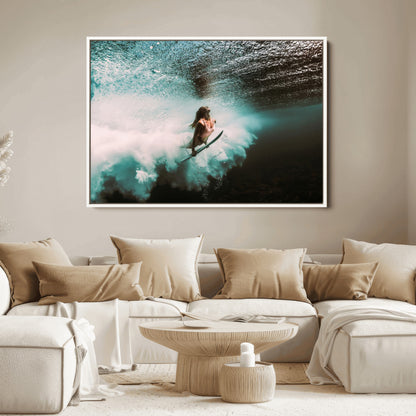 Vibrant underwater photo of a female surfer diving through turquoise waves, perfect for coastal boho or surf-inspired home decor.