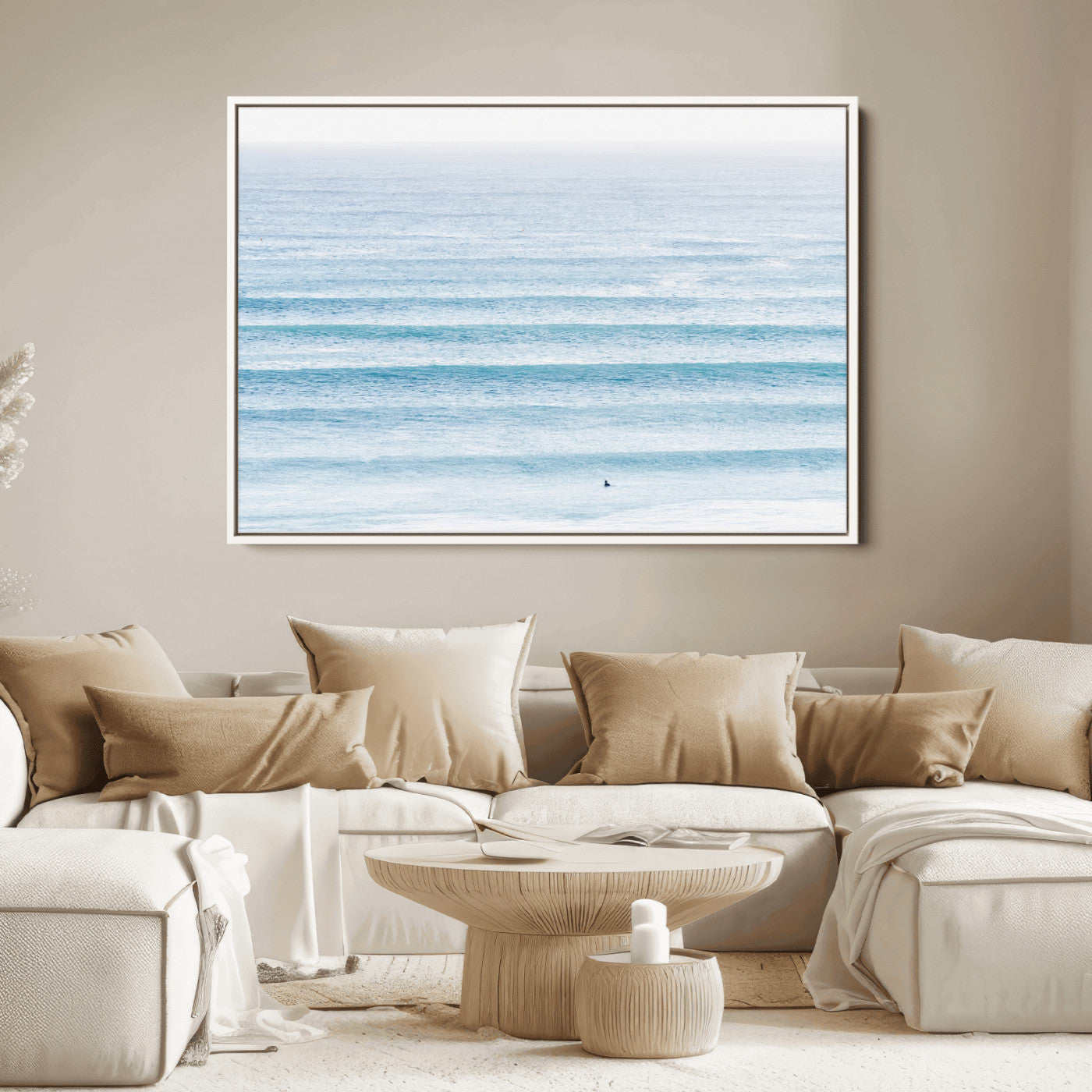 Minimalist ocean view with soft blue waves and a lone surfer, creating a serene and airy coastal aesthetic, perfect for tranquil home decor.