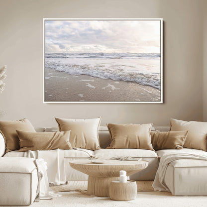 Peaceful ocean waves rolling onto the sandy shore under soft light, perfect for neutral or coastal minimalist decor themes.
