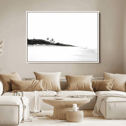 A black and white minimalist coastal scene with a vast open beach, distant palm trees, and a lone figure walking along the shoreline, evoking serenity and solitude.