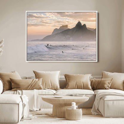 A surfer rides a golden hour wave near misty coastal mountains, surrounded by fellow surfers, capturing the spirit of a coastal adventure.
