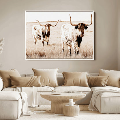 Two Texas longhorn cows standing in a sepia-toned pasture, evoking rustic charm perfect for farmhouse or western country interiors. (