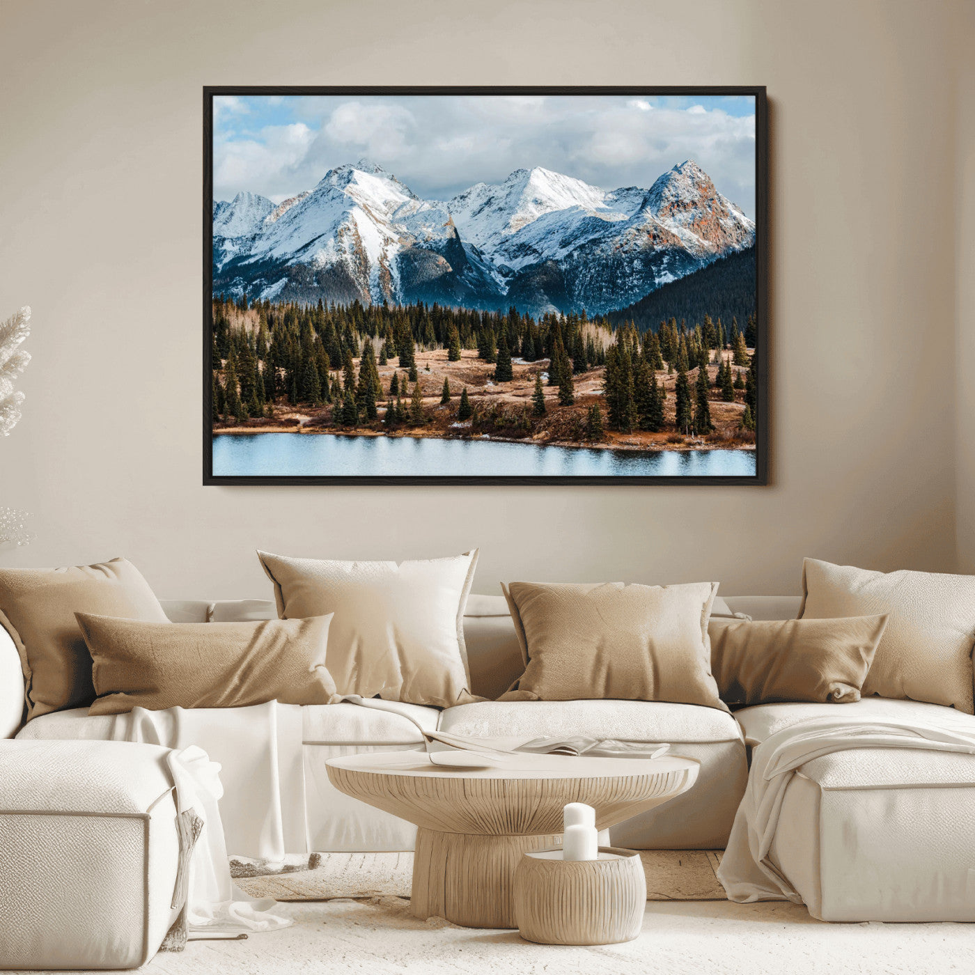 Framed canvas of snowy mountain peaks with pine forest and alpine lake, perfect for winter cabin or wilderness-inspired home decor.