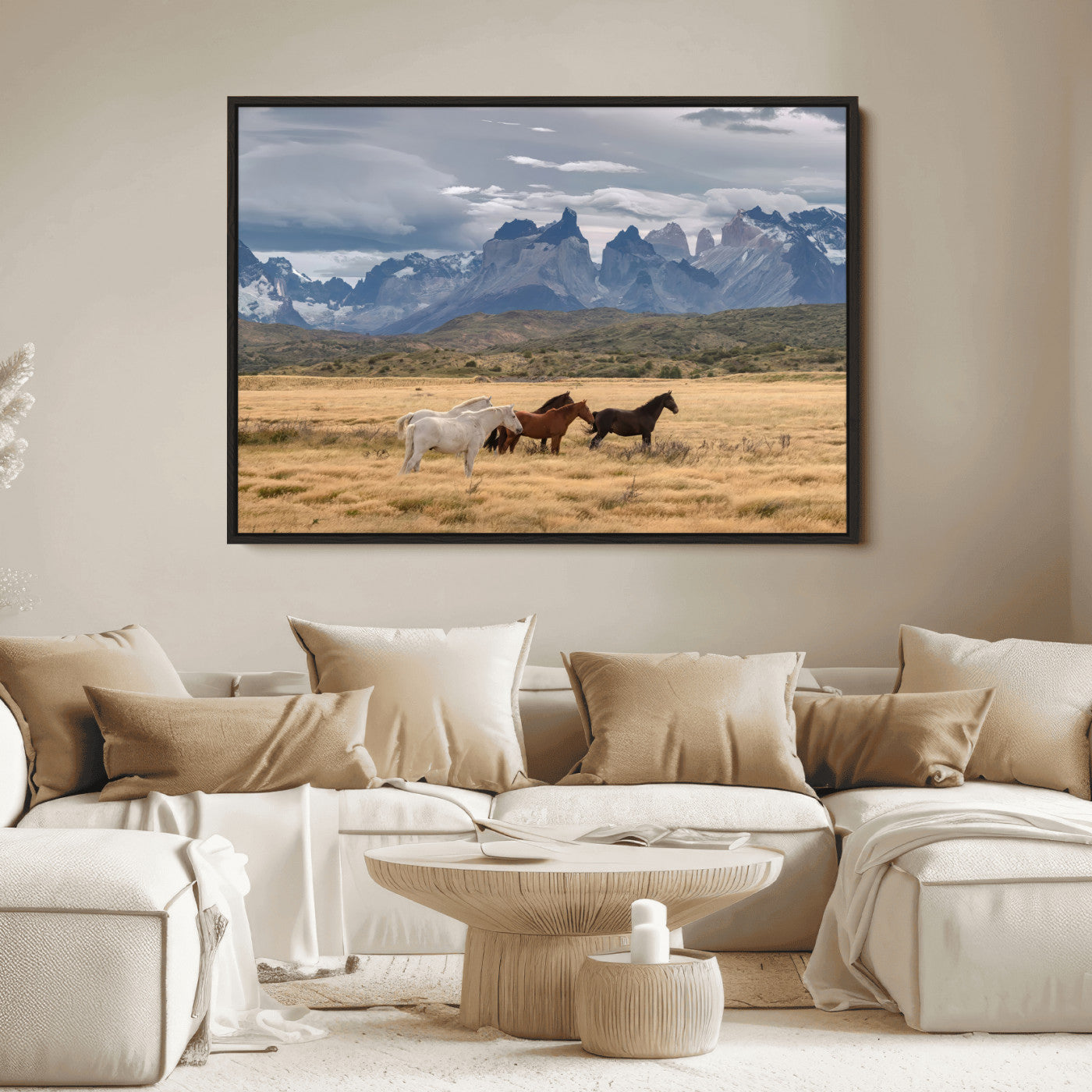 Framed canvas of wild horses grazing in golden Patagonian fields with dramatic mountain backdrop, ideal for rustic or wilderness-inspired decor.