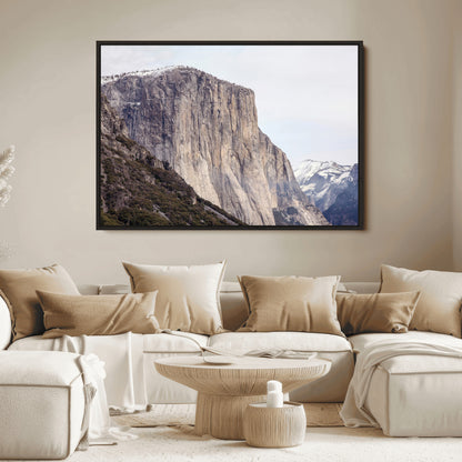 Framed canvas of El Capitan’s vertical granite face in Yosemite with snowy peaks, ideal for Sierra minimalism or mountain-inspired decor.