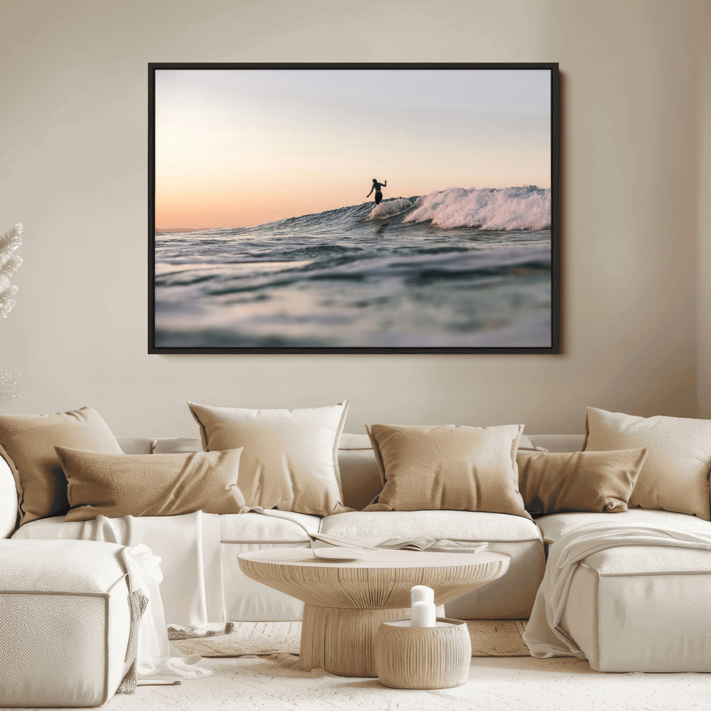 Framed canvas of a female surfer balancing on a wave at sunset, perfect for serene surf or ocean-inspired coastal decor.