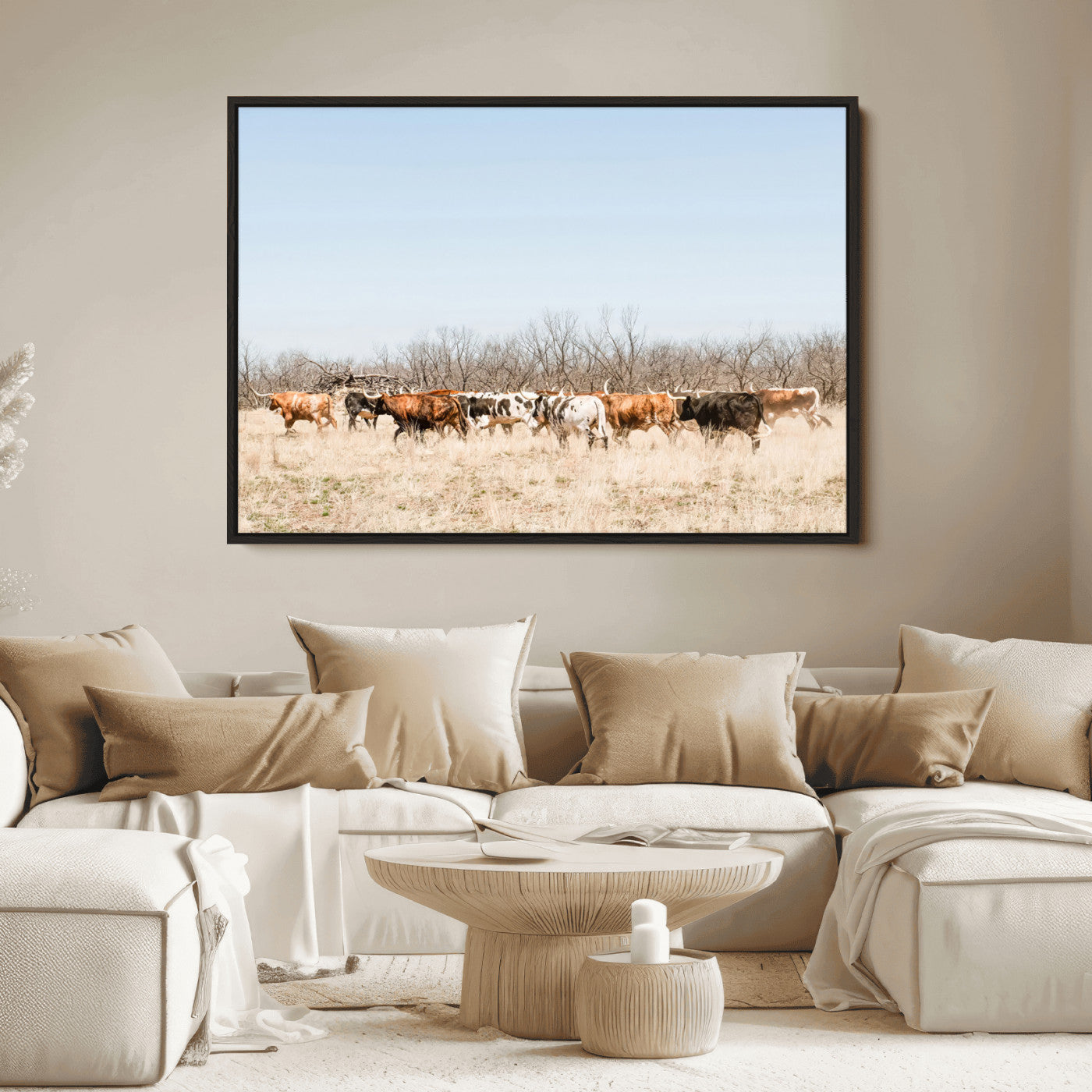 Framed wall art of Texas longhorn cattle walking through a dry, neutral-toned prairie, perfect for rustic farmhouse or western-themed home decor.