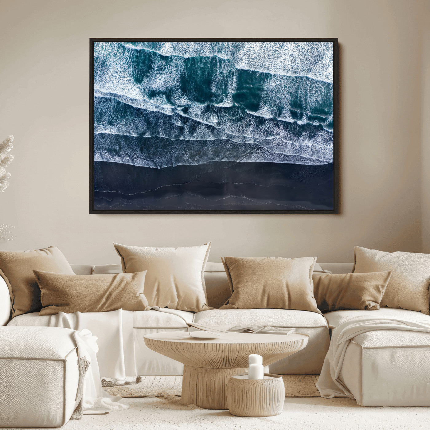 Canvas of aerial ocean waves crashing onto a black sand beach in moody tones, ideal for modern coastal or minimalist home decor.