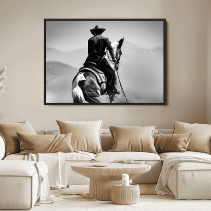 Black and white canvas of a cowboy on horseback with moody tones, perfect for rustic western or country-inspired home decor.