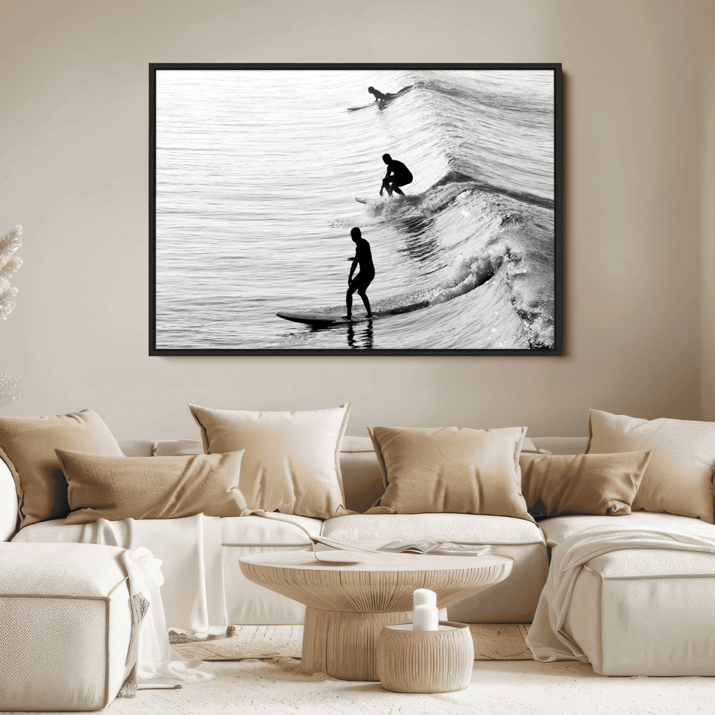 Black and white photo of surfers riding waves in a moody, high-contrast scene, ideal for modern coastal or surf-inspired home decor.