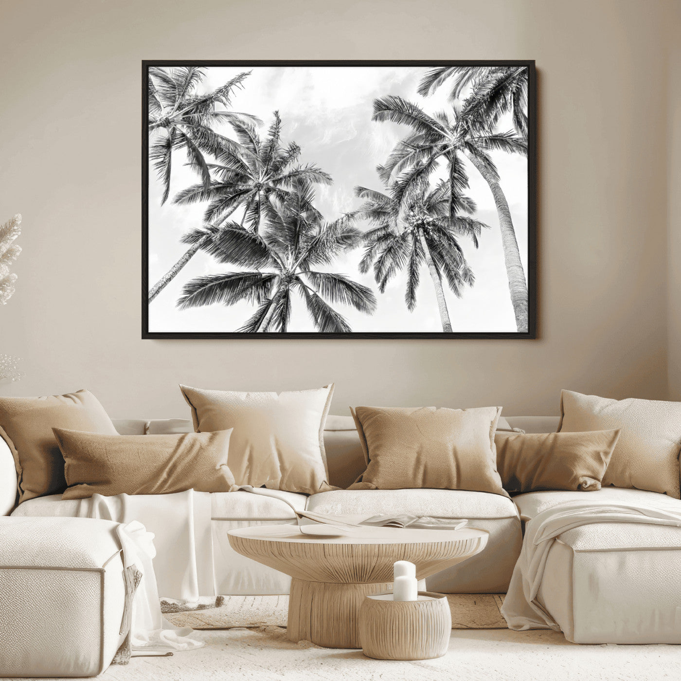 Black and white tropical palm trees viewed from below, swaying gently against a bright sky, creating a serene and elegant coastal atmosphere.