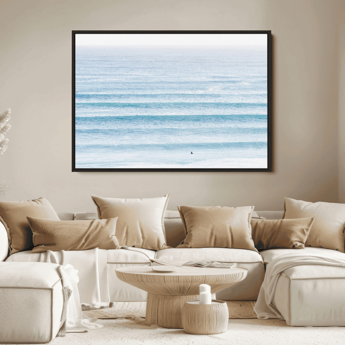 Minimalist ocean view with soft blue waves and a lone surfer, creating a serene and airy coastal aesthetic, perfect for tranquil home decor.