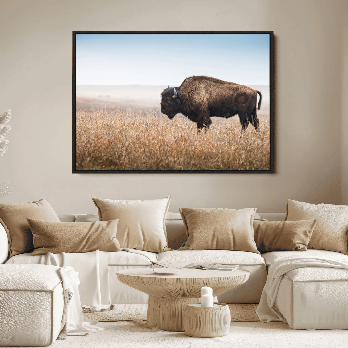 A majestic bison standing in an open prairie field, its strong form blending into the golden grass under a vast blue sky, evoking the wild spirit of the American plains.