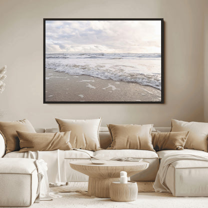 Peaceful ocean waves rolling onto the sandy shore under soft light, perfect for neutral or coastal minimalist decor themes.
