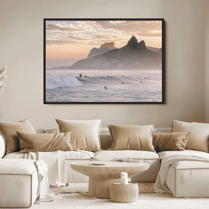 A surfer rides a golden hour wave near misty coastal mountains, surrounded by fellow surfers, capturing the spirit of a coastal adventure.