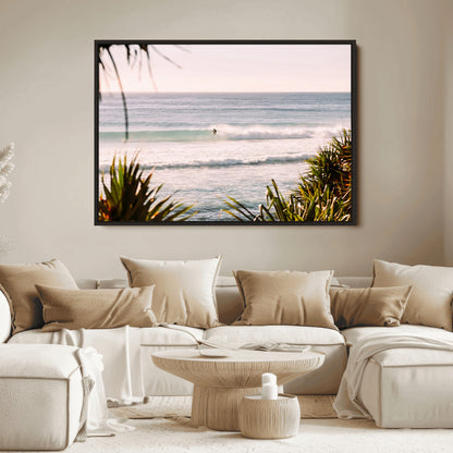 Canvas of a lone surfer riding a pastel wave at sunrise, perfect for tropical or coastal-themed spaces with a relaxed, airy vibe.