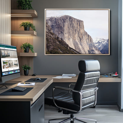 Framed canvas of El Capitan’s vertical granite face in Yosemite with snowy peaks, ideal for Sierra minimalism or mountain-inspired decor.