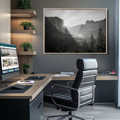 Black and white landscape of Yosemite with sun rays peeking over El Capitan, ideal for moody nature or modern rustic decor.
