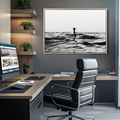 Black and white ocean with a hand making a surfer sign among dark waves, creating a dramatic and minimalist seascape with bold contrast.