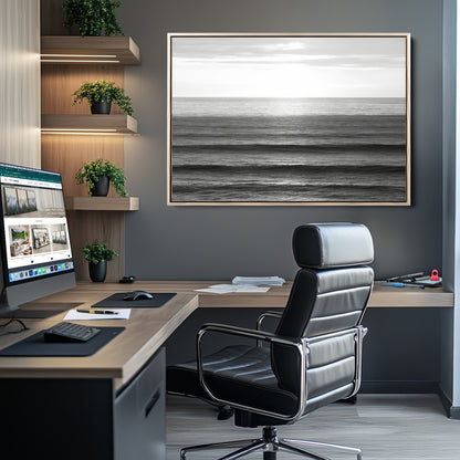 Minimalist black and white ocean view with layered waves reflecting sunlight, evoking a sense of calm and coastal serenity.