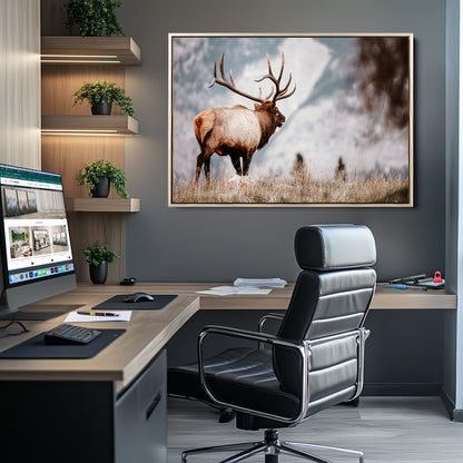Majestic elk with large antlers standing in grass with snowy mountains in background, perfect for rustic cabin or lodge style decor.