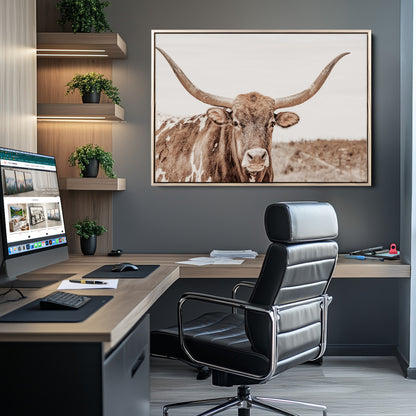 A longhorn cow in soft beige desert tones, standing calmly in open land, perfect for neutral western or rustic farmhouse interiors.