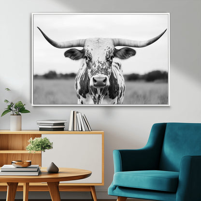 Capture the strength and elegance of nature with this striking black and white portrait of a longhorn cow. Its powerful presence makes a bold statement in any room.