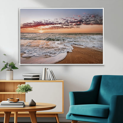 Canvas of a sunset over a foamy ocean shore with warm light and gentle waves, ideal for coastal or beach-themed home decor.