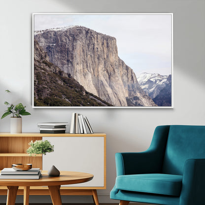Framed canvas of El Capitan’s vertical granite face in Yosemite with snowy peaks, ideal for Sierra minimalism or mountain-inspired decor.
