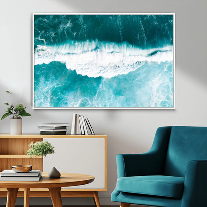 Aerial view of turquoise ocean waves crashing with white foam, perfect for tropical coastal or modern beach-style home decor.