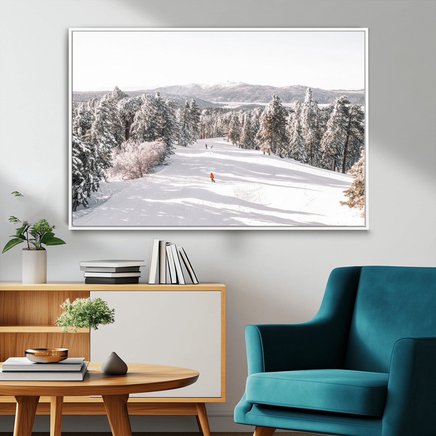 Bright ski trail lined with snow-covered pines and a skier in orange, perfect for alpine adventure or winter sports-inspired decor.