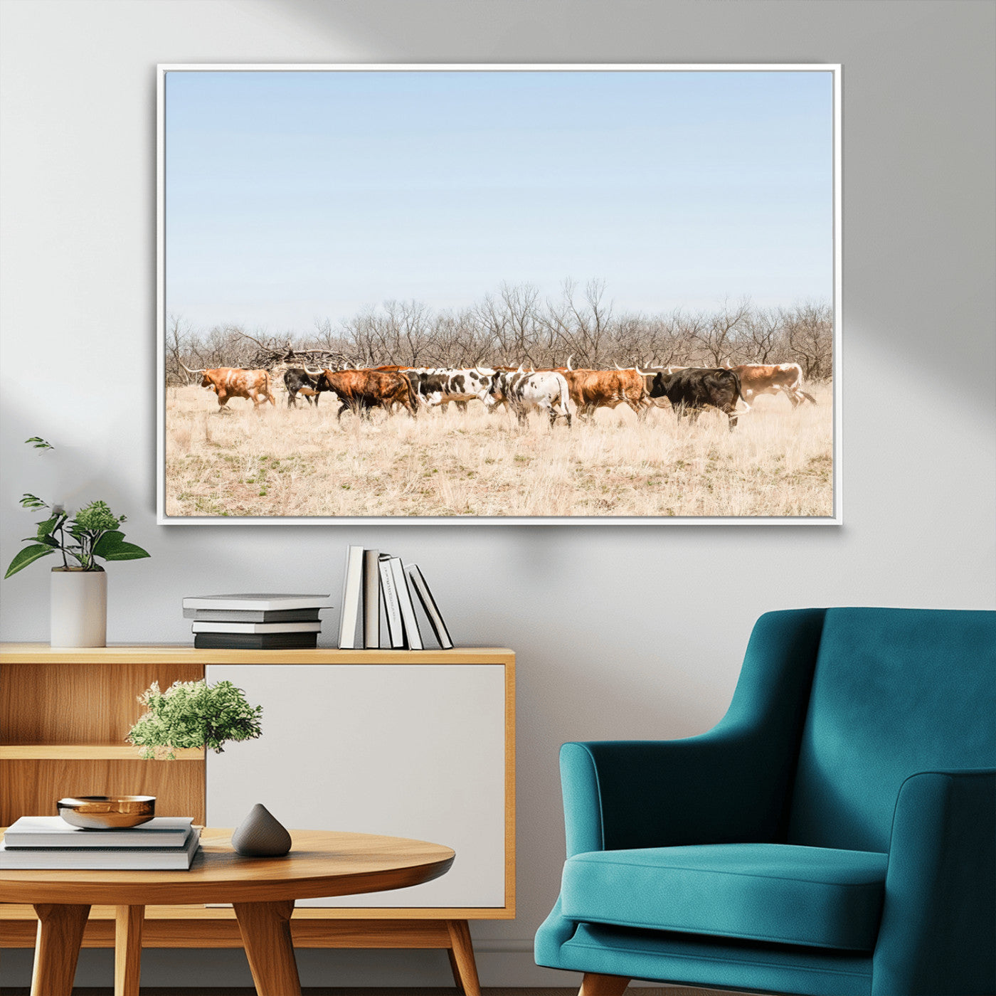 Framed wall art of Texas longhorn cattle walking through a dry, neutral-toned prairie, perfect for rustic farmhouse or western-themed home decor.