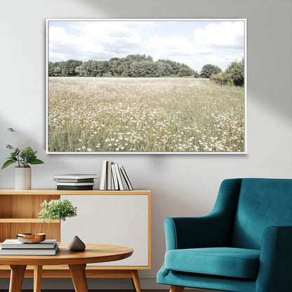 Soft-toned image of a wild daisy field under a cloudy sky, ideal for neutral or Scandinavian-inspired home decor.