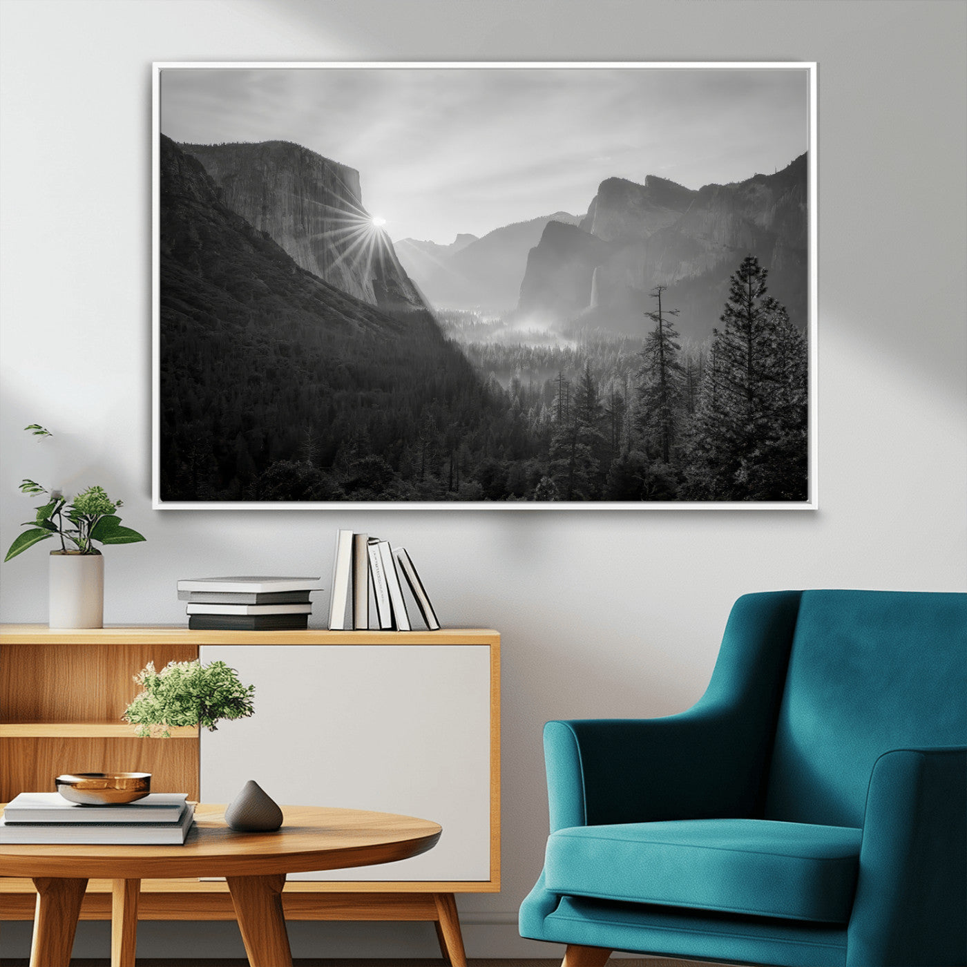 Black and white landscape of Yosemite with sun rays peeking over El Capitan, ideal for moody nature or modern rustic decor.