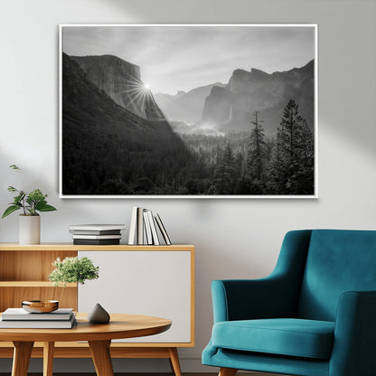Black and white landscape of Yosemite with sun rays peeking over El Capitan, ideal for moody nature or modern rustic decor.