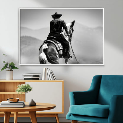 Black and white canvas of a cowboy on horseback with moody tones, perfect for rustic western or country-inspired home decor.