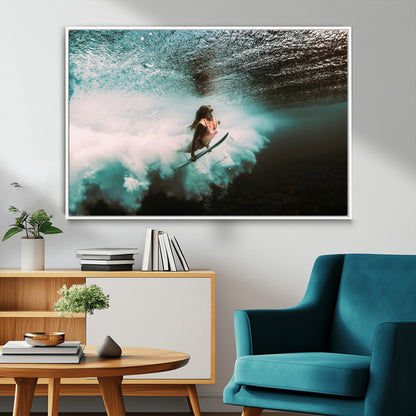 Vibrant underwater photo of a female surfer diving through turquoise waves, perfect for coastal boho or surf-inspired home decor.