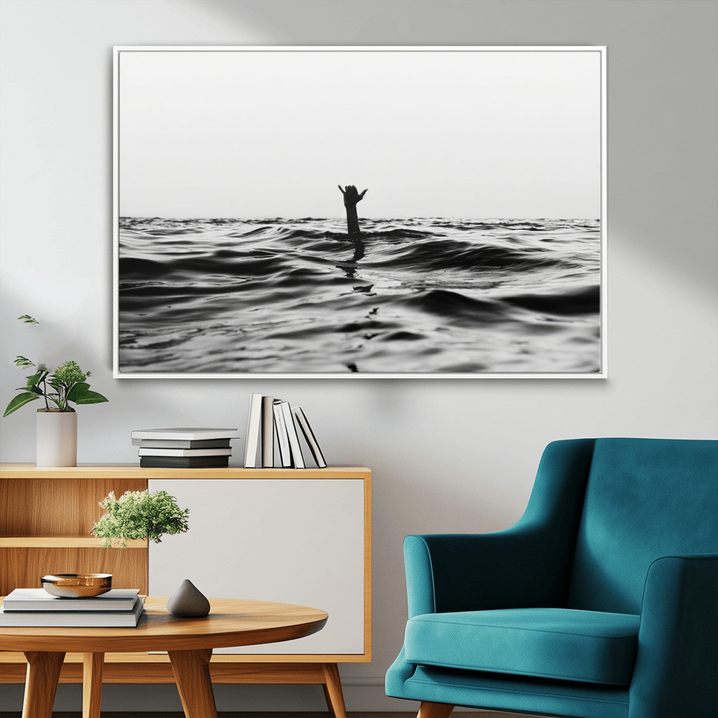 Black and white ocean with a hand making a surfer sign among dark waves, creating a dramatic and minimalist seascape with bold contrast.