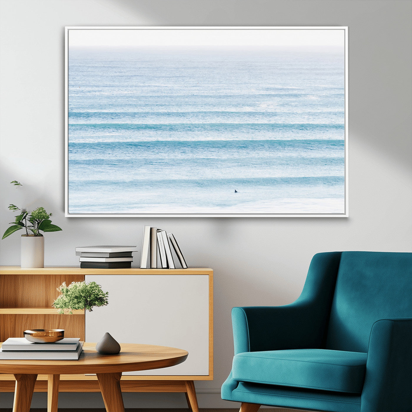 Minimalist ocean view with soft blue waves and a lone surfer, creating a serene and airy coastal aesthetic, perfect for tranquil home decor.