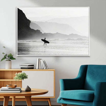 A lone surfer walking along a misty beach with cliffs in the background, carrying their board, capturing a serene and minimal ocean moment.
